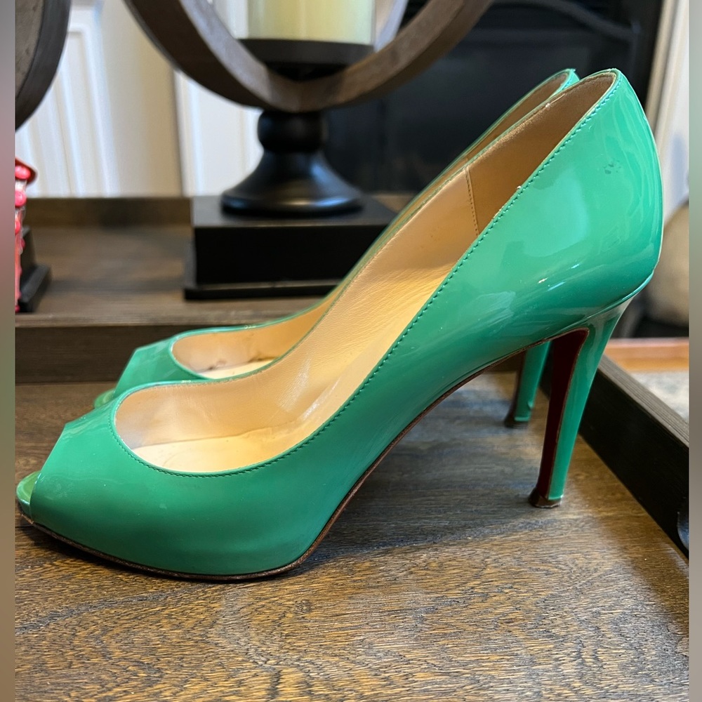 Christian Louboutin peep toe pumps.